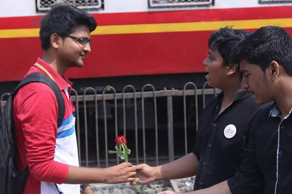Going Gandhian way: Commuters crossing railway tracks greeted with roses