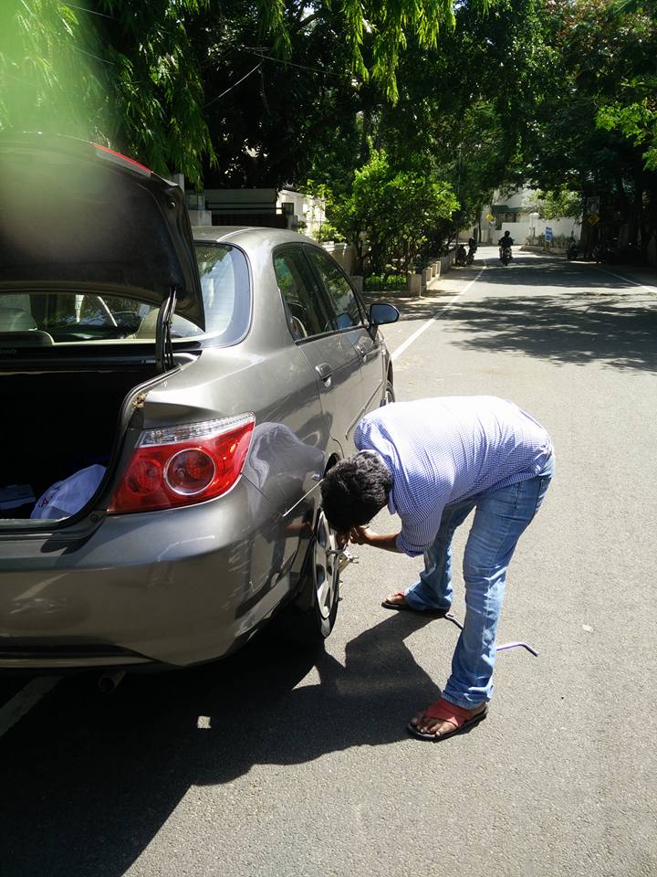 Uber driver turns mechanic, repairs passenger's flat tire instead of giving him a ride