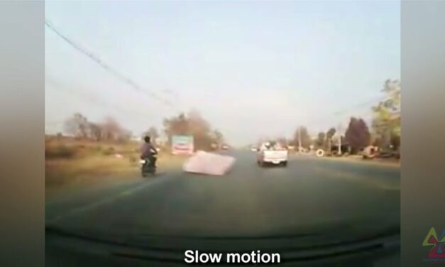 Viral Video: Man falls off bike after being hit by a flying mattress