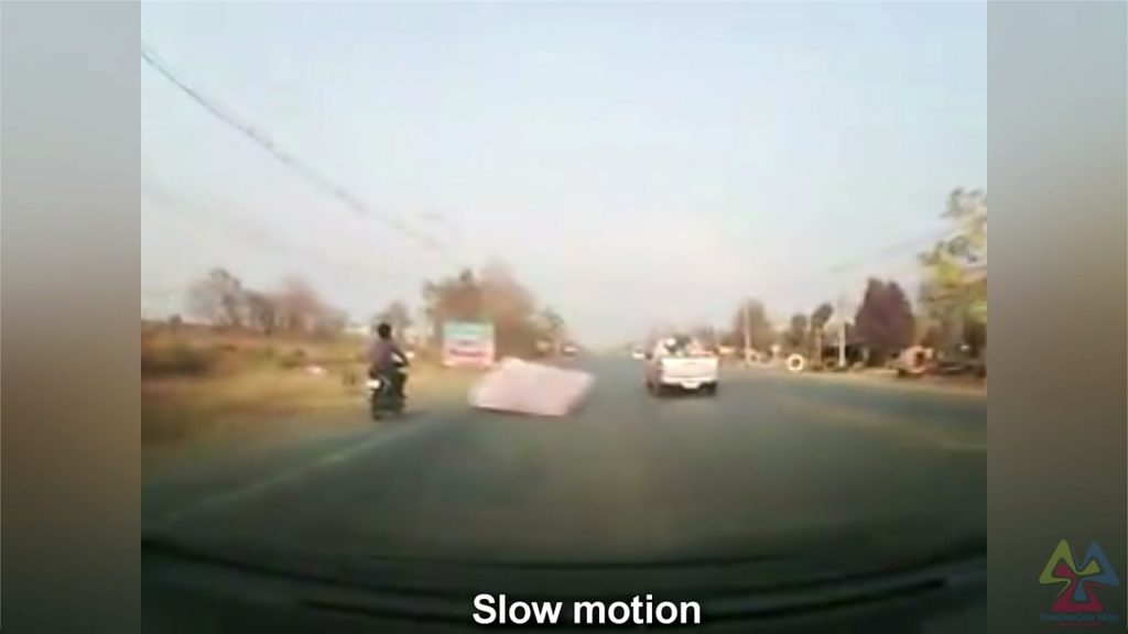 Viral Video: Man falls off bike after being hit by a flying mattress