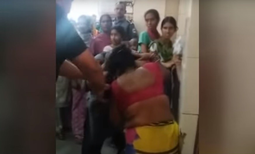 Video: Guard brutally assaults woman for breaking line at hospital 6