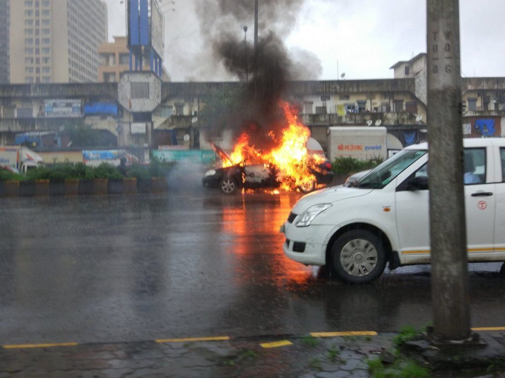 Headline: Car catches fire on Western Express Highway near Hub Mall, Goregaon 1