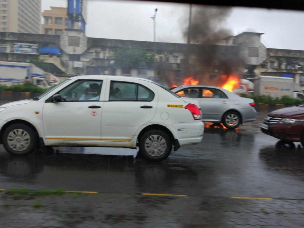 Headline: Car catches fire on Western Express Highway near Hub Mall, Goregaon 2