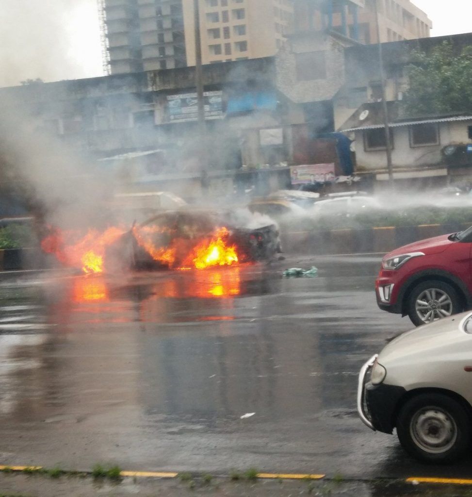 Headline: Car catches fire on Western Express Highway near Hub Mall, Goregaon 4