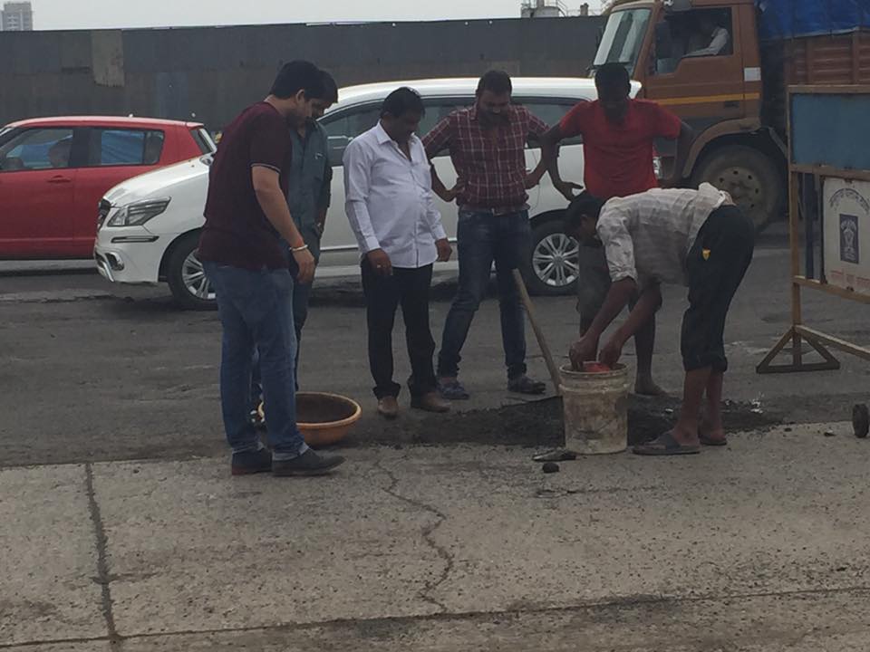 Fed up of waiting for authorities to fill potholes on WEH, 4 bikers take matters into their own hands