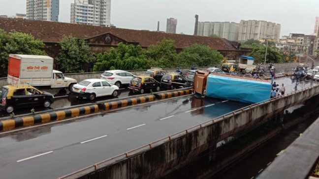 Truck overturns on Lalbaug flyover, traffic affected